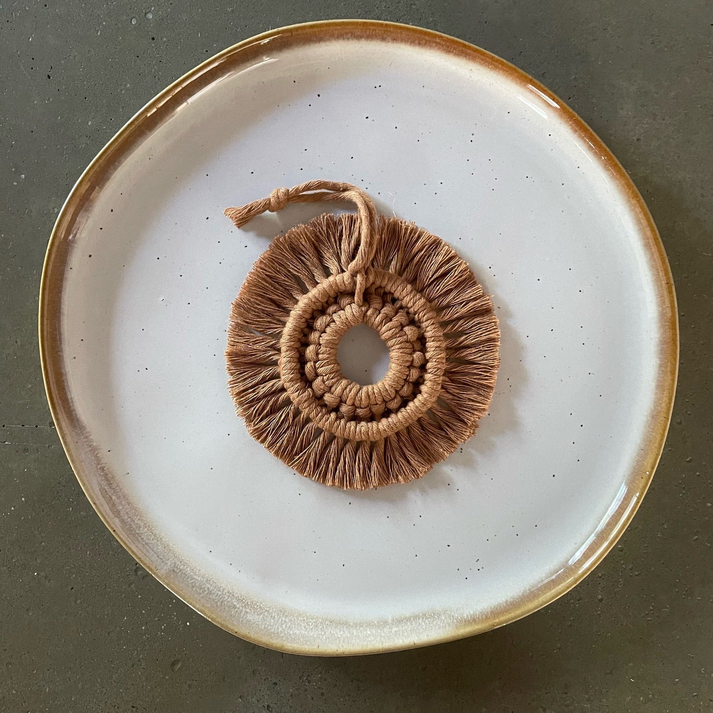 Caramel Wreath Ornament centered on dinner plate