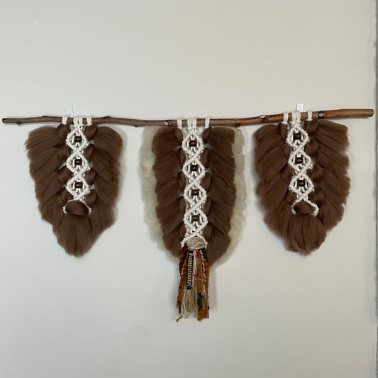 Plumage - Tobacco - Trio on white wall