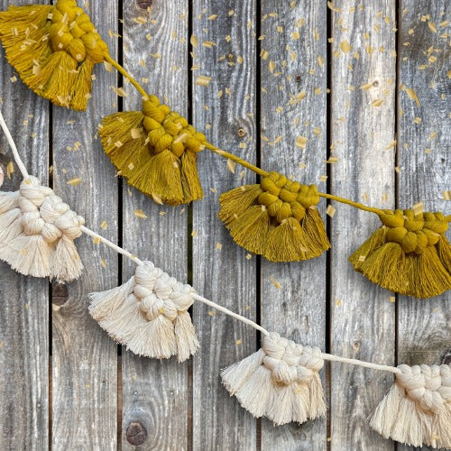 Festive Garland Over Rustic Wood Fence