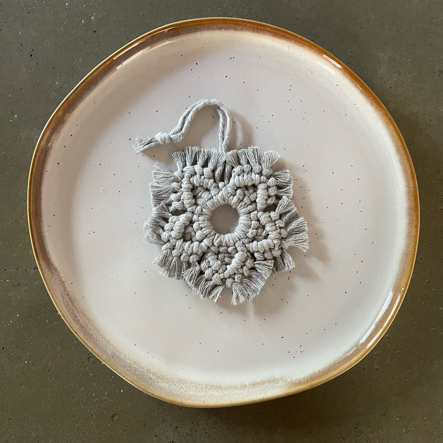 Silver Snowflake Ornament centered on dinner plate
