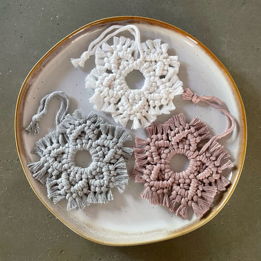 3 Snowflake Ornaments grouped on dinner plate