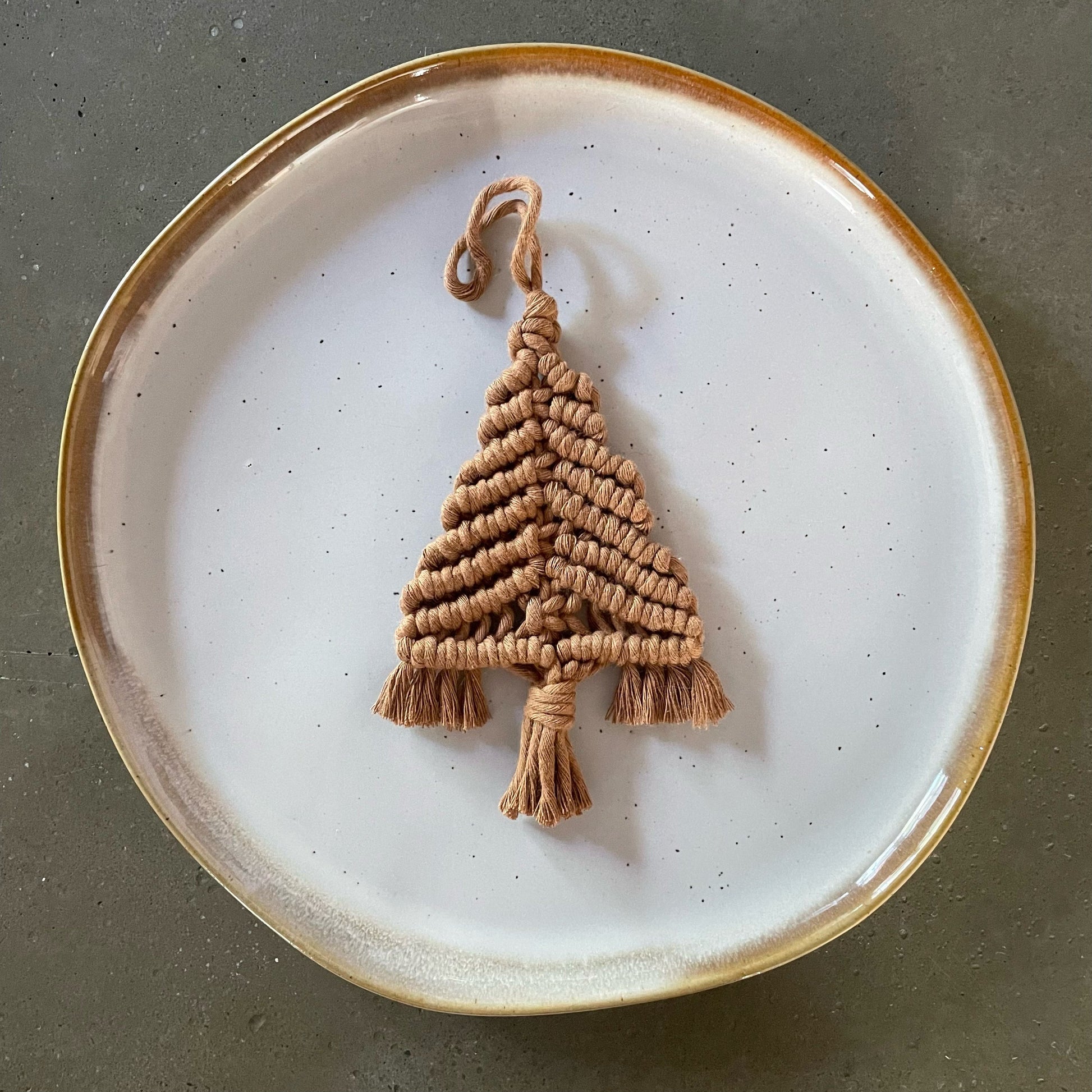 Caramel Tree Ornament centered on dinner plate