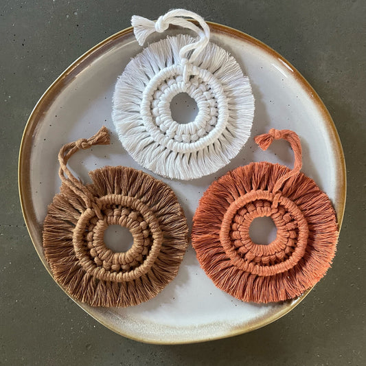 3 Wreath Ornaments grouped on dinner plate